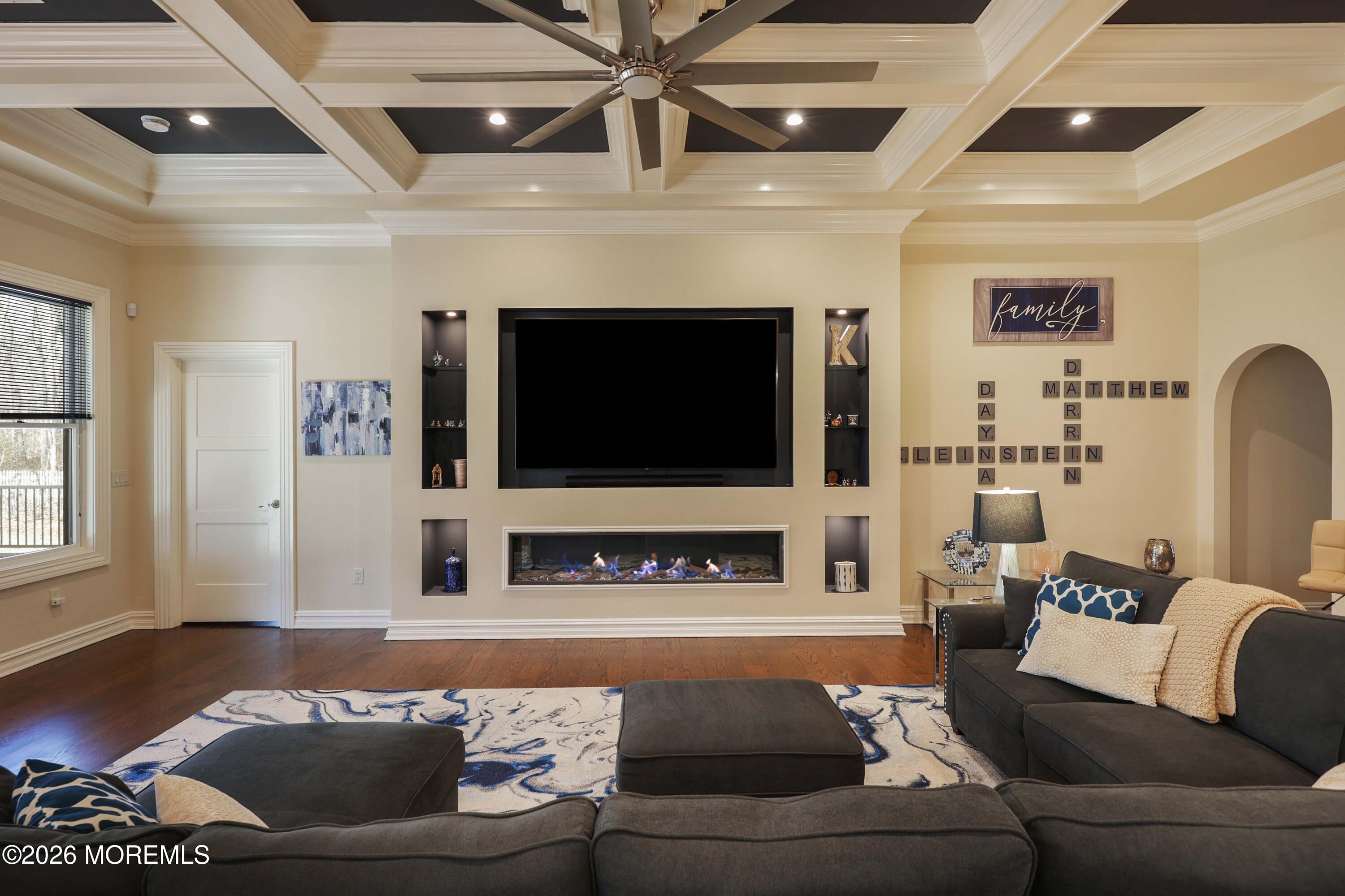 786 Holly Berry Lane Brick, NJ 08724 - Photo 16 of 52 a living room with furniture and a flat screen tv