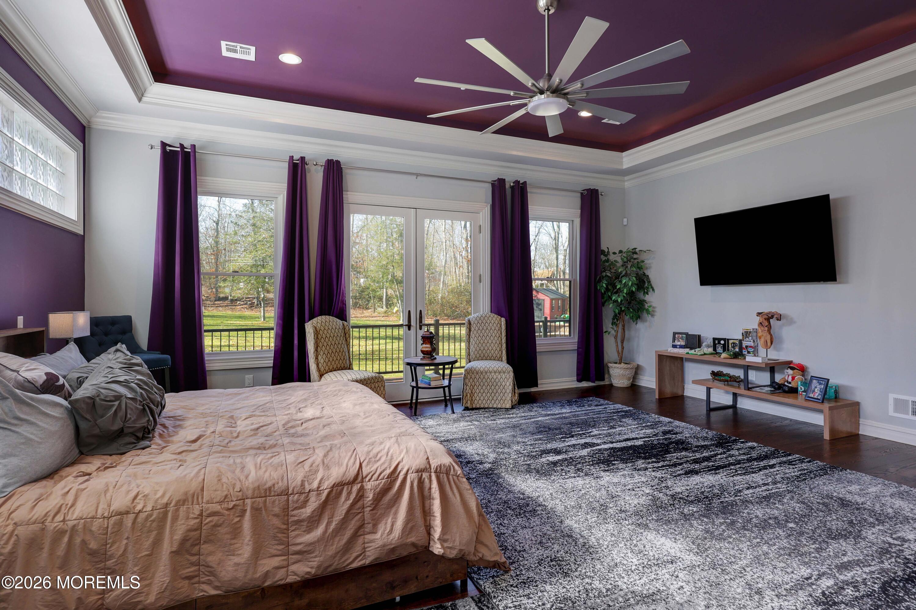 786 Holly Berry Lane Brick, NJ 08724 - Photo 19 of 52 a bedroom with a bed and a flat screen tv