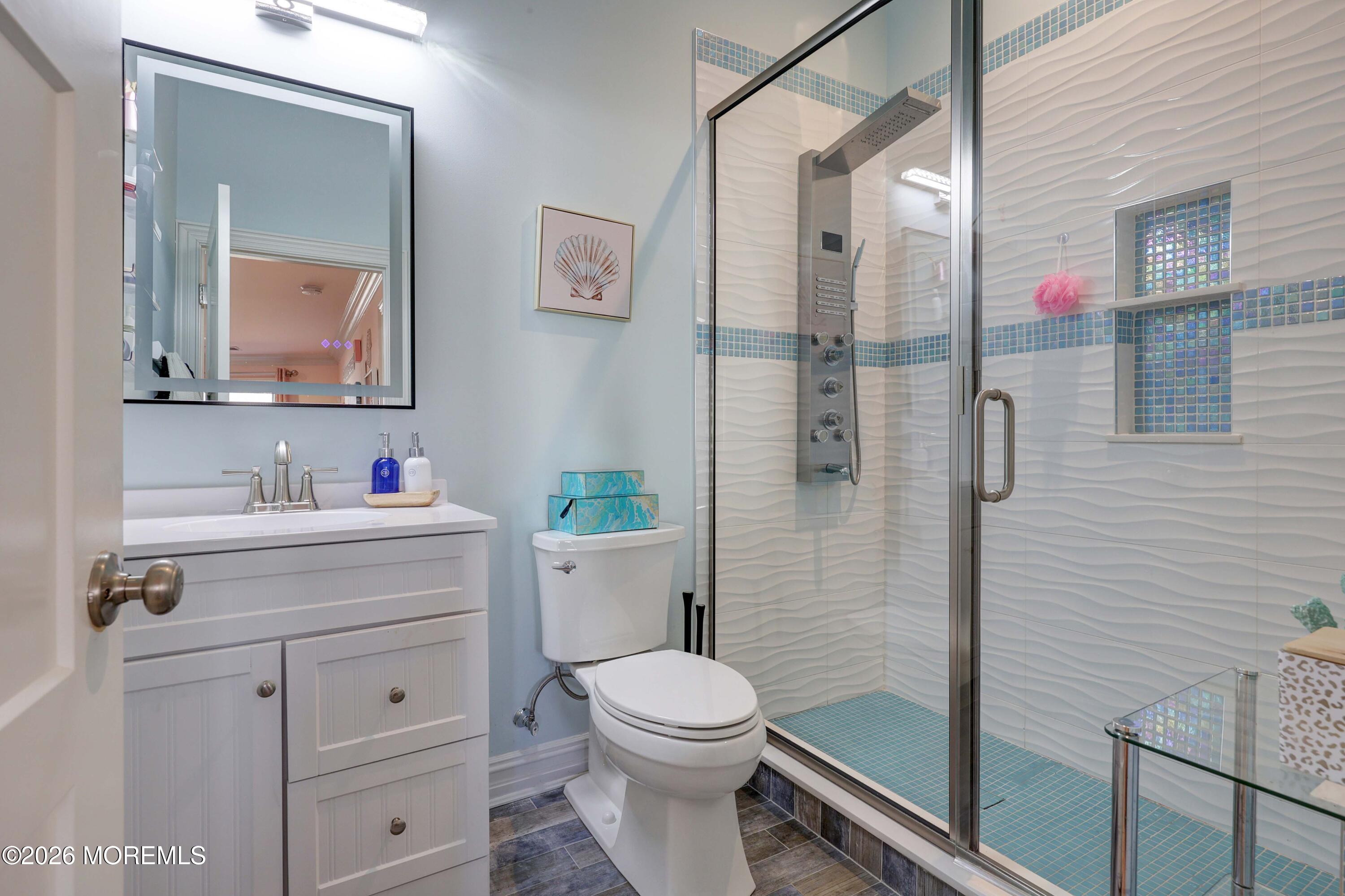 786 Holly Berry Lane Brick, NJ 08724 - Photo 28 of 52 a bathroom with a sink a toilet and shower