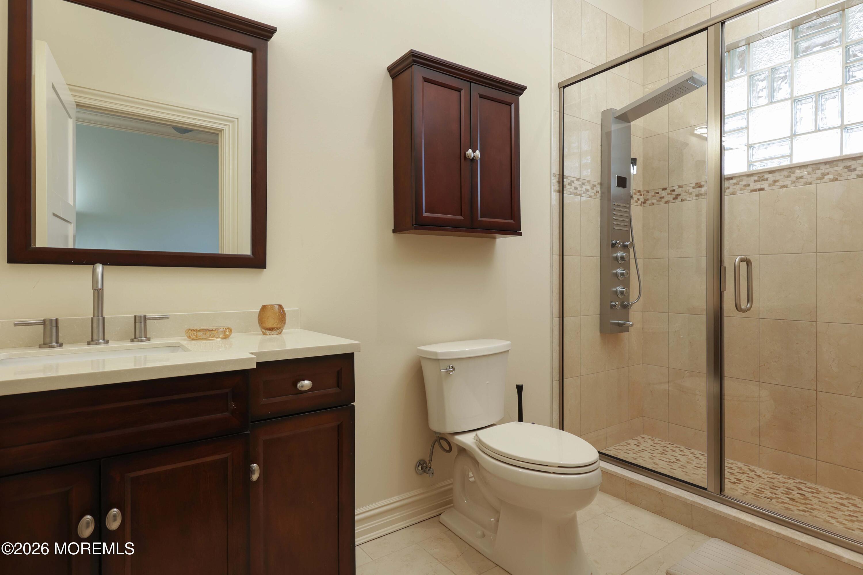 786 Holly Berry Lane Brick, NJ 08724 - Photo 31 of 52 a bathroom with a toilet a sink a vanity and mirror
