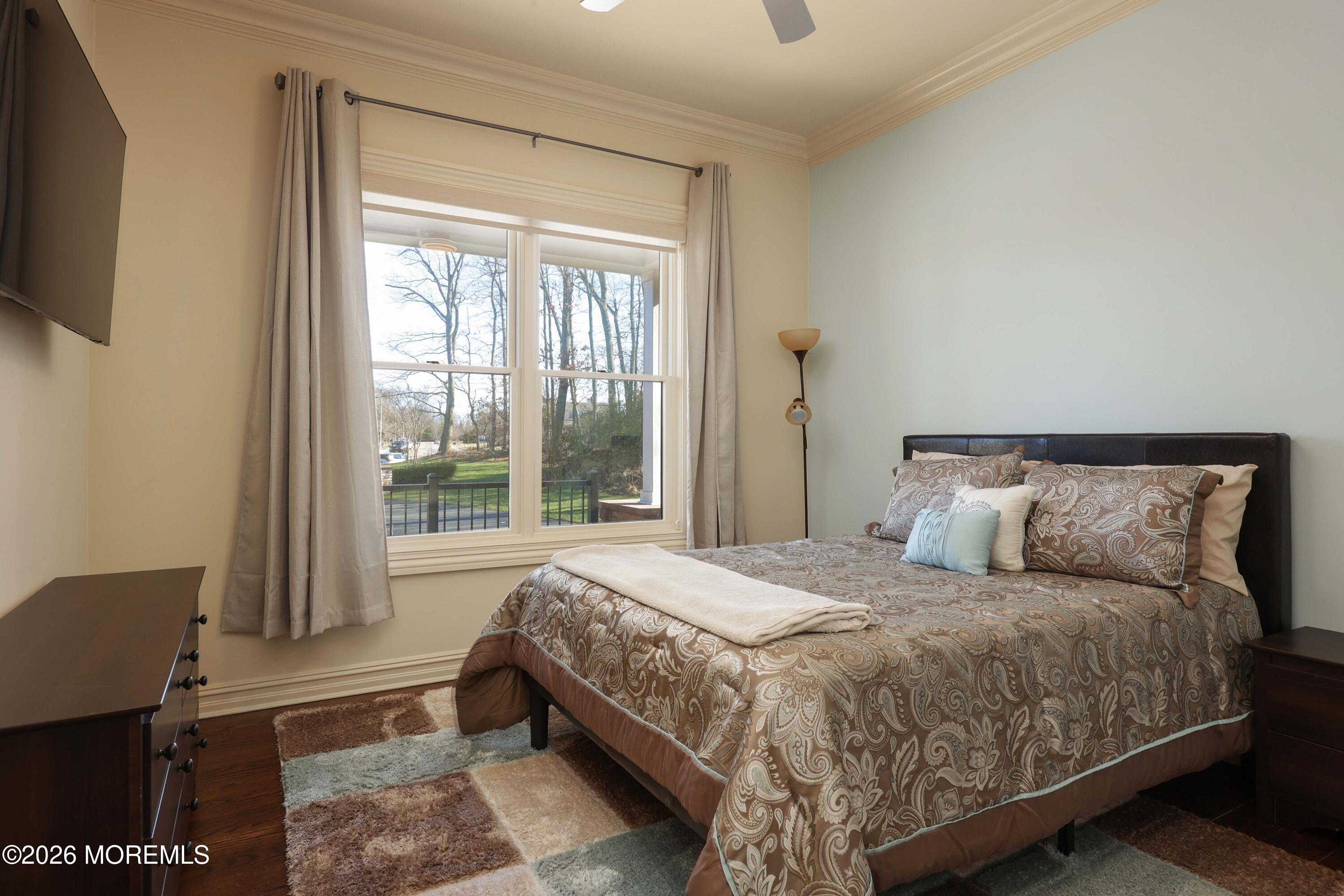 786 Holly Berry Lane Brick, NJ 08724 - Photo 32 of 52 a bedroom with a bed and glass window