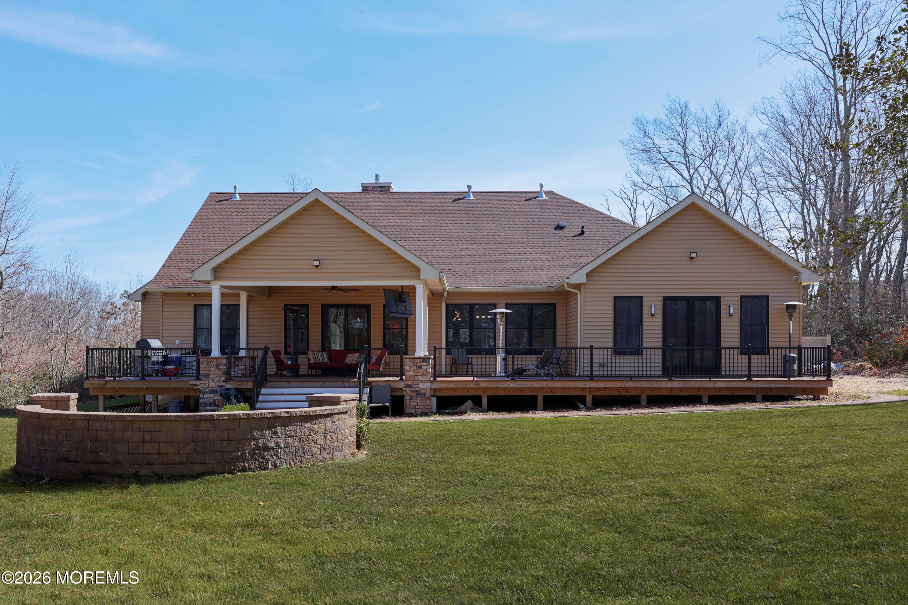 786 Holly Berry Lane Brick, NJ 08724 - Photo 39 of 52 a front view of a house with a yard and trees