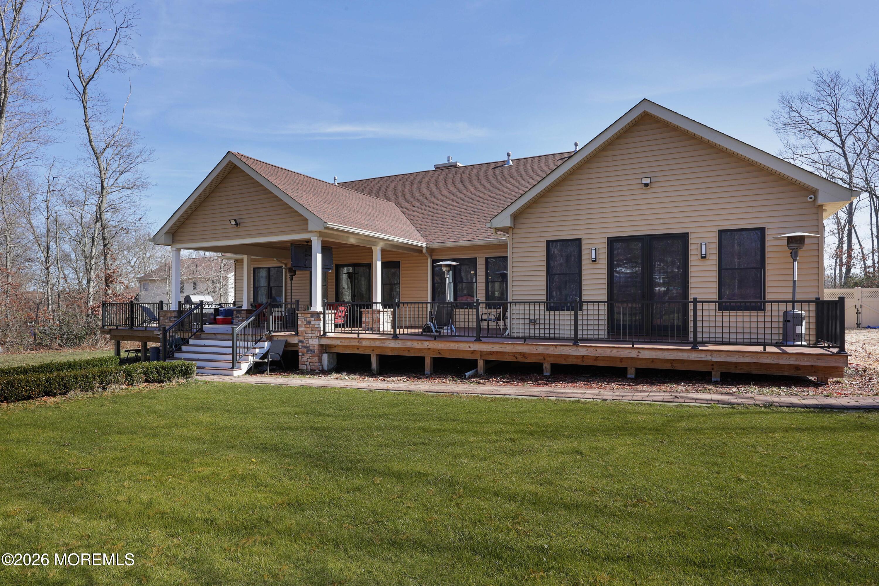 786 Holly Berry Lane Brick, NJ 08724 - Photo 40 of 52 a view of a house with a yard porch and sitting area