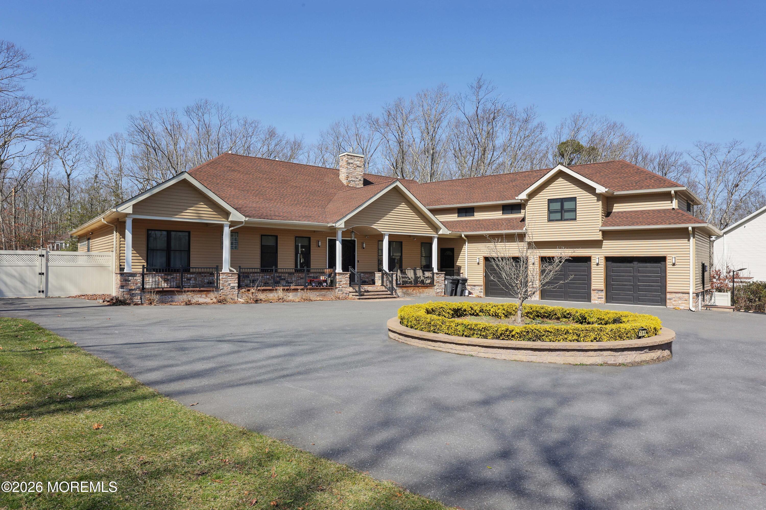 786 Holly Berry Lane Brick, NJ 08724 - Photo 47 of 52 a front view of a house with a garden