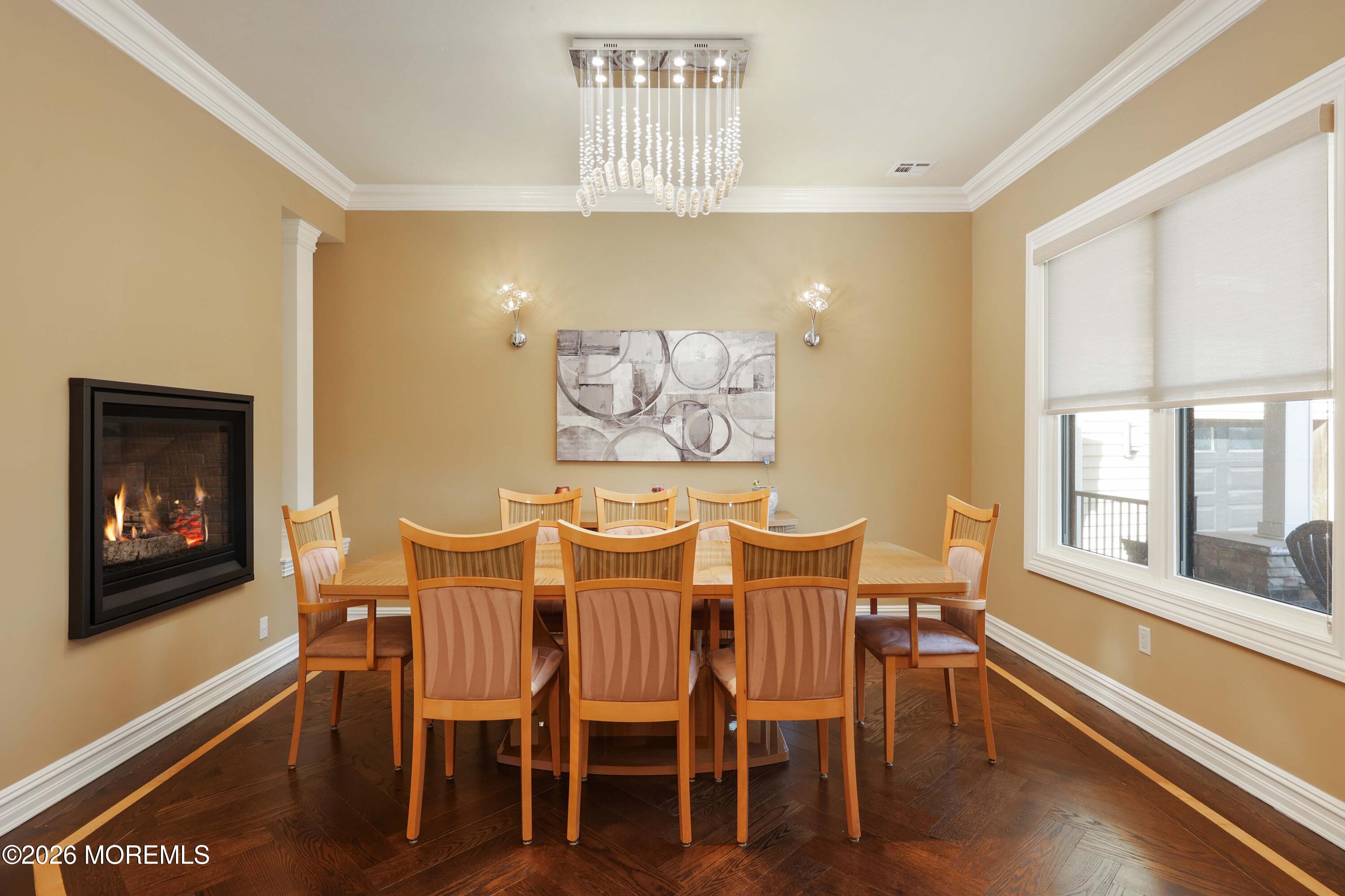 786 Holly Berry Lane Brick, NJ 08724 - Photo 7 of 52 a dining room with furniture wooden floor a rug and a painting