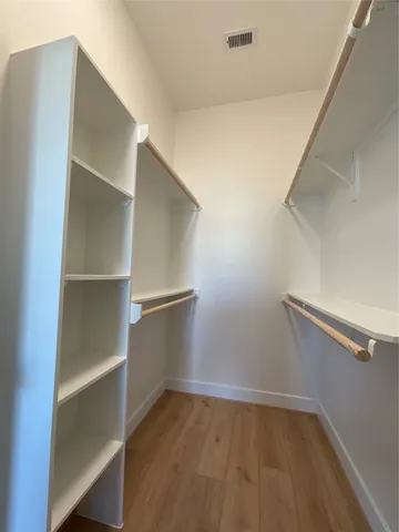 a view of an empty walk in closet