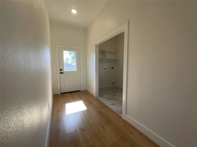 a view of entryway with wooden floor