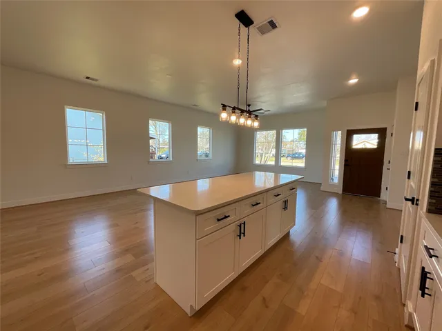 a large kitchen with a large window