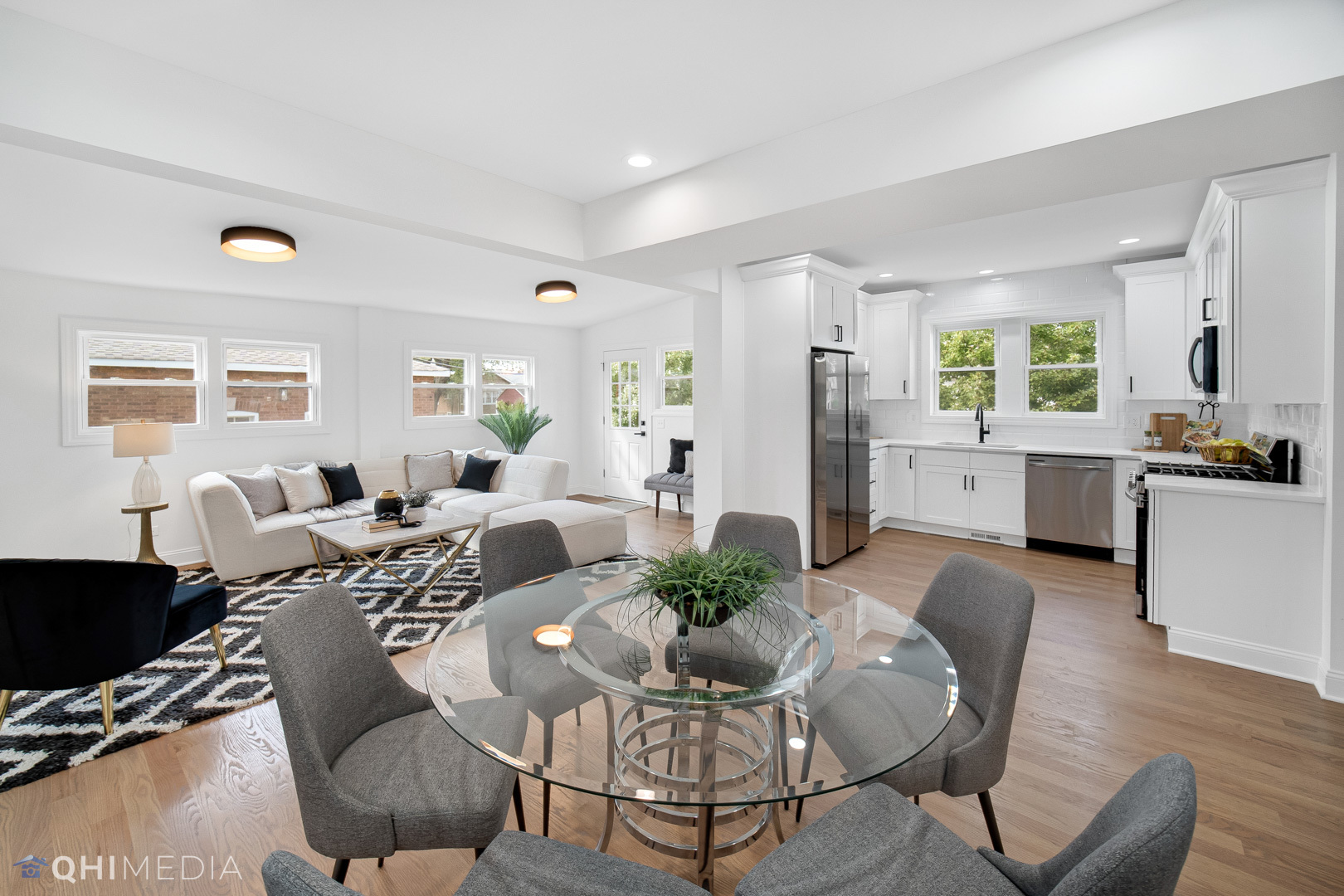 5459 West Grace Street Chicago, IL 60641 - Photo 11 of 24 a living room with furniture dining table and a large window