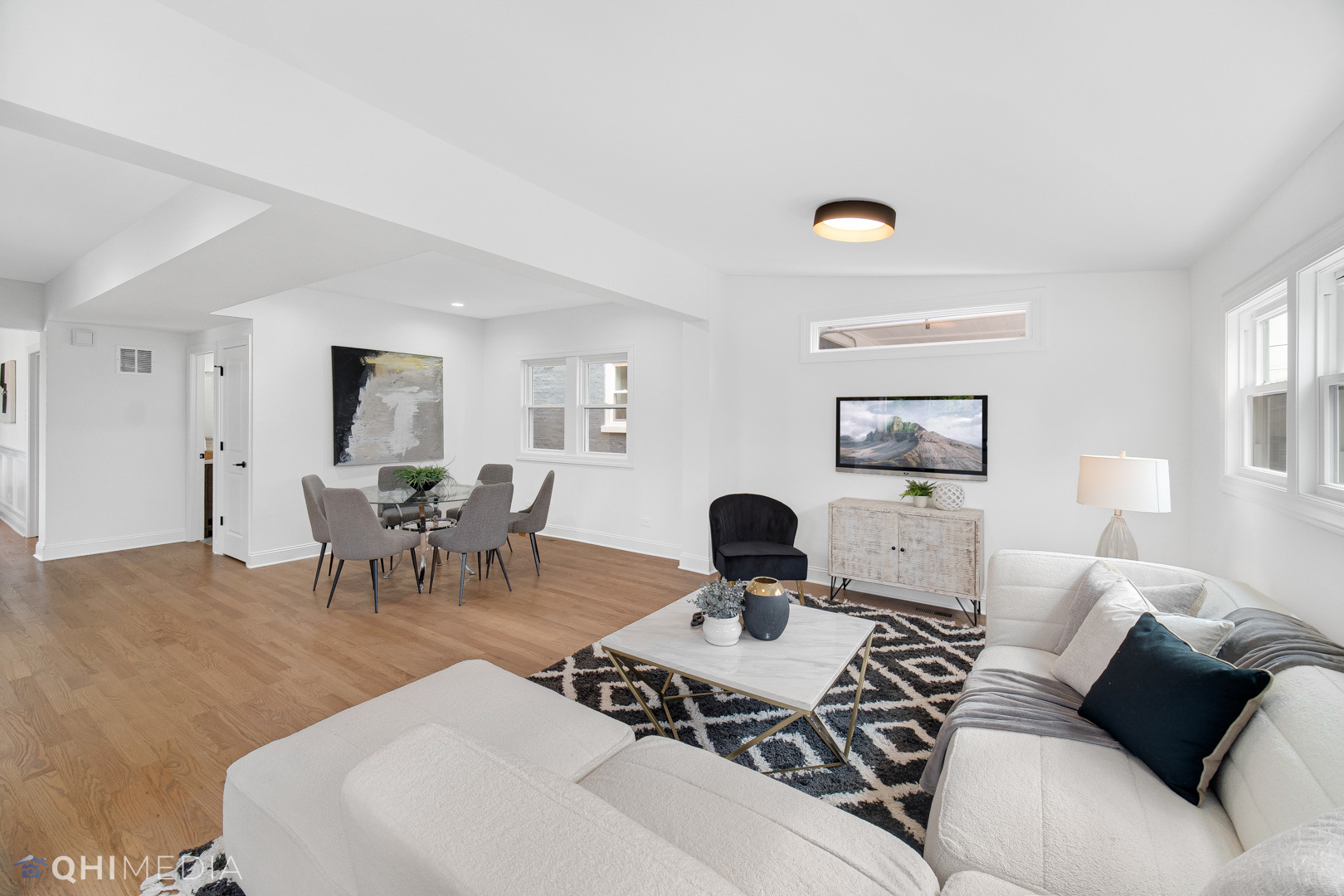 5459 West Grace Street Chicago, IL 60641 - Photo 12 of 24 a living room with furniture a rug and a window