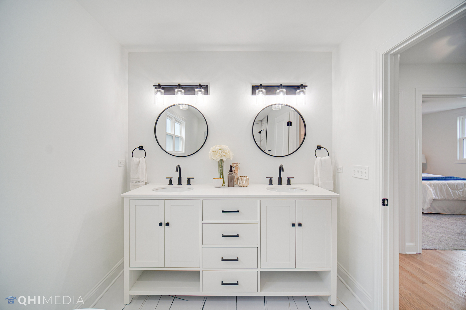 5459 West Grace Street Chicago, IL 60641 - Photo 16 of 24 a bathroom with double vanity sink and a mirror