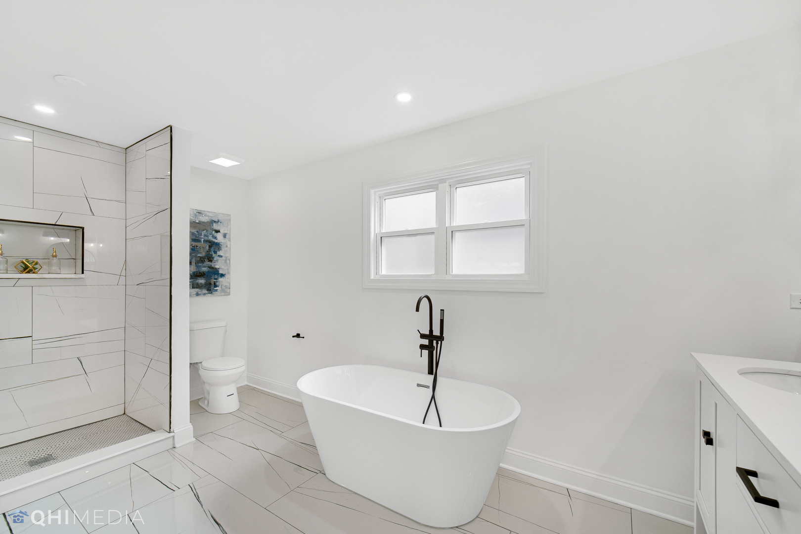 5459 West Grace Street Chicago, IL 60641 - Photo 18 of 24 a spacious bathroom with a bathtub and shower