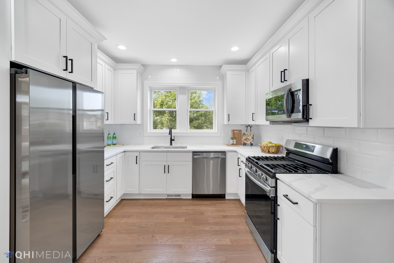 5459 West Grace Street Chicago, IL 60641 - Photo 8 of 24 a kitchen with a refrigerator sink and stove