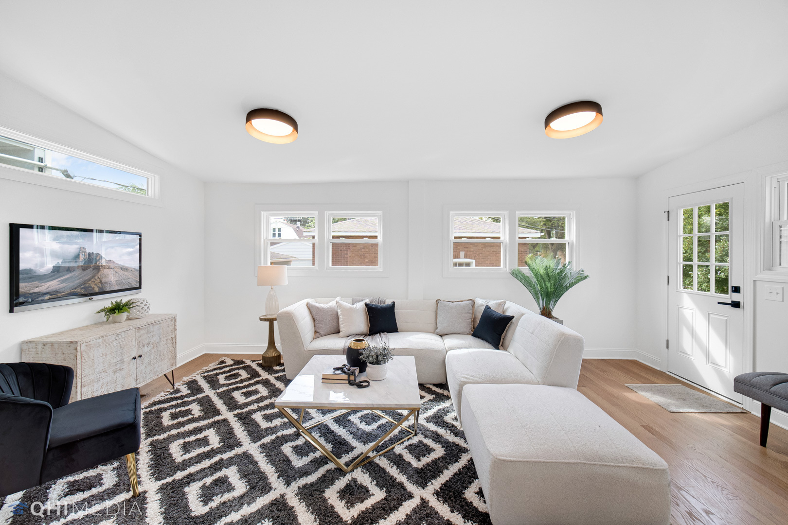 5459 West Grace Street Chicago, IL 60641 - Photo 9 of 24 a living room with furniture a fireplace and a flat screen tv