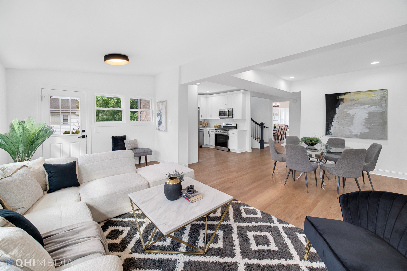 5459 West Grace Street Chicago, IL 60641 - Photo 10 of 24 a living room with furniture and a table