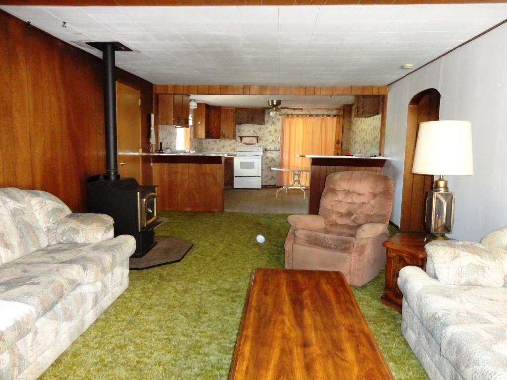 140 Riverview Road Hayfork, CA 96041 - Photo 11 of 21 a living room with furniture and a lamp