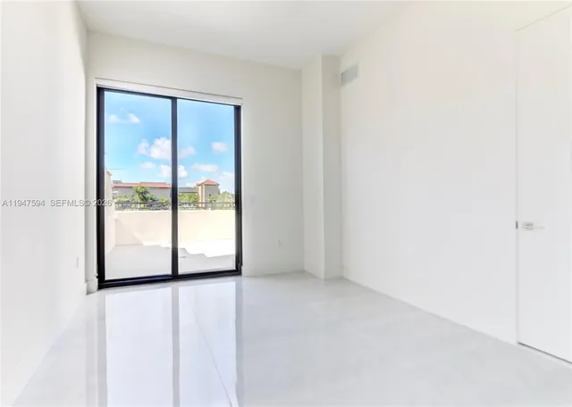 a view of an empty room with window