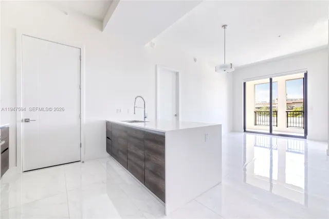 a spacious bathroom with a double vanity sink a mirror and a bathtub