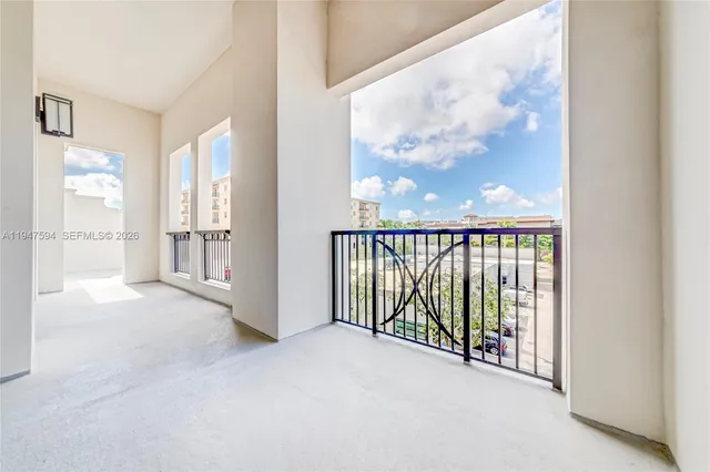 a view of a glass door with a balcony