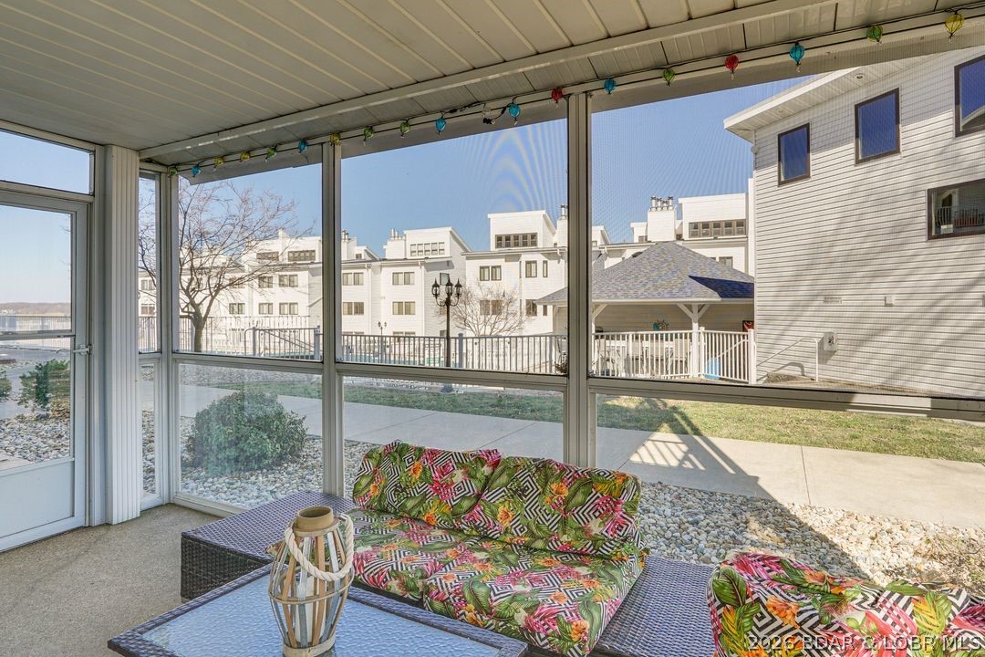 1101 Passover Road, Unit R2 Osage Beach, MO 65065 - Photo 6 of 48 Screened and covered patio