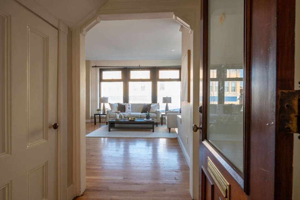 191 Main Street, Unit 2A Gloucester, MA 01930 - Photo 8 of 15 a view of a living room and a balcony