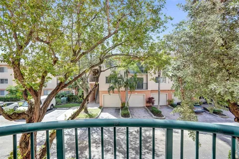 a view of balcony with two trees