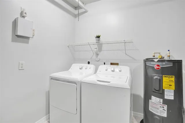 a front view of residential houses with yard and green space