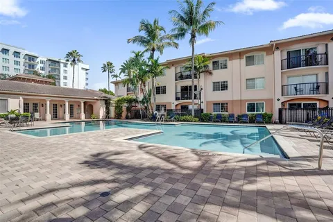a backyard of a house with outdoor seating