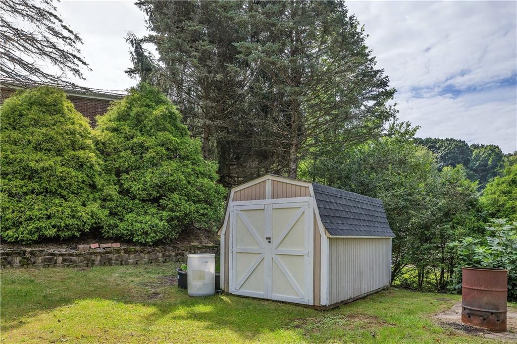 1792 McClure Road Monroeville, PA 15146 - Photo 35 of 41 Side yard and a shed.