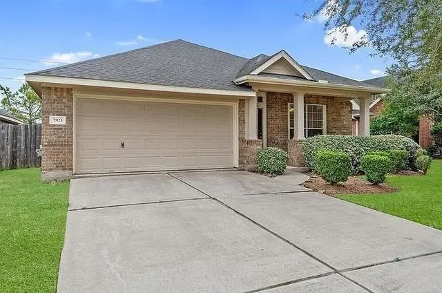 front view of a house with a garden