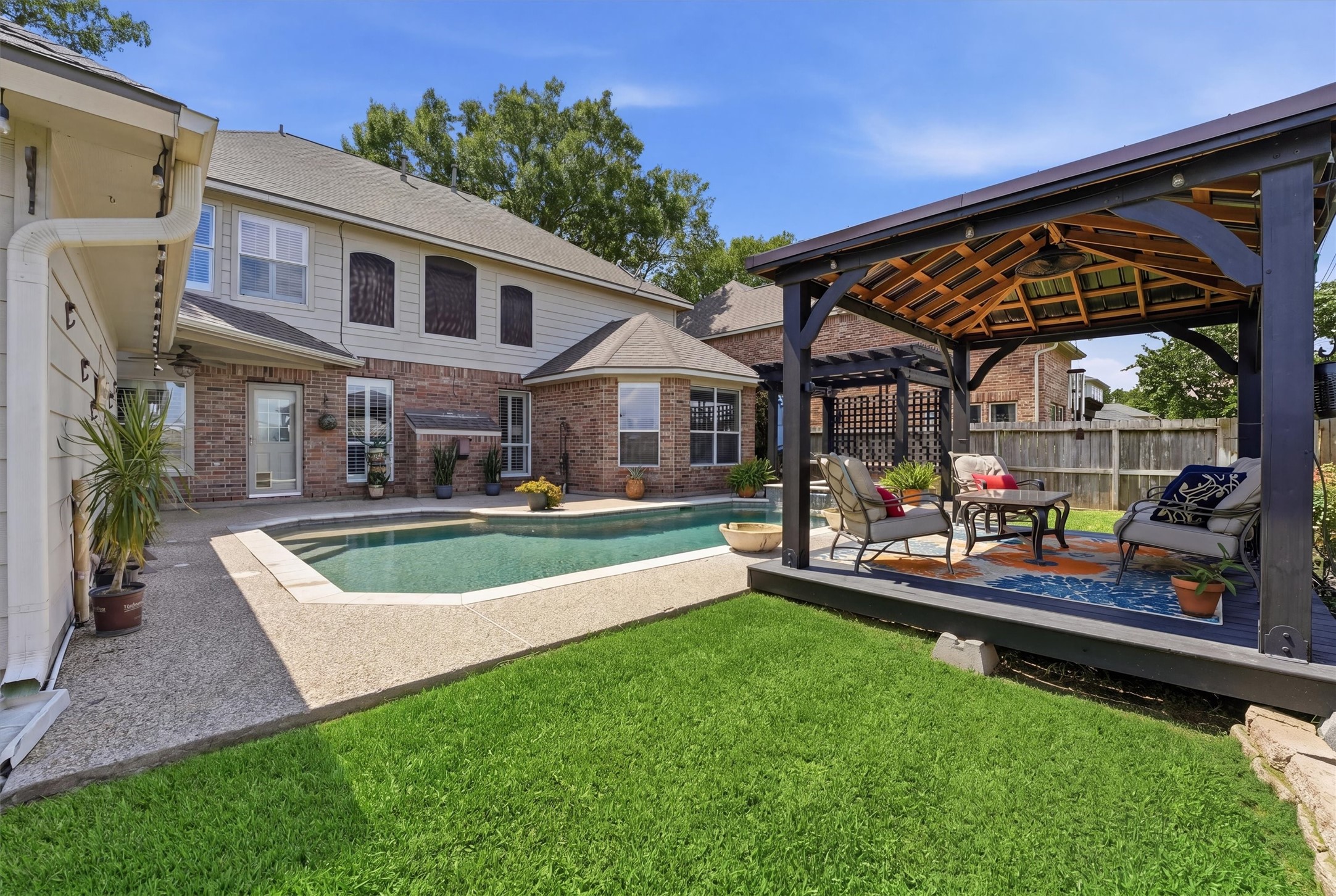 25181 Ramrock Drive Porter, TX 77365 - Photo 26 of 35 a view of a house with a backyard and sitting area