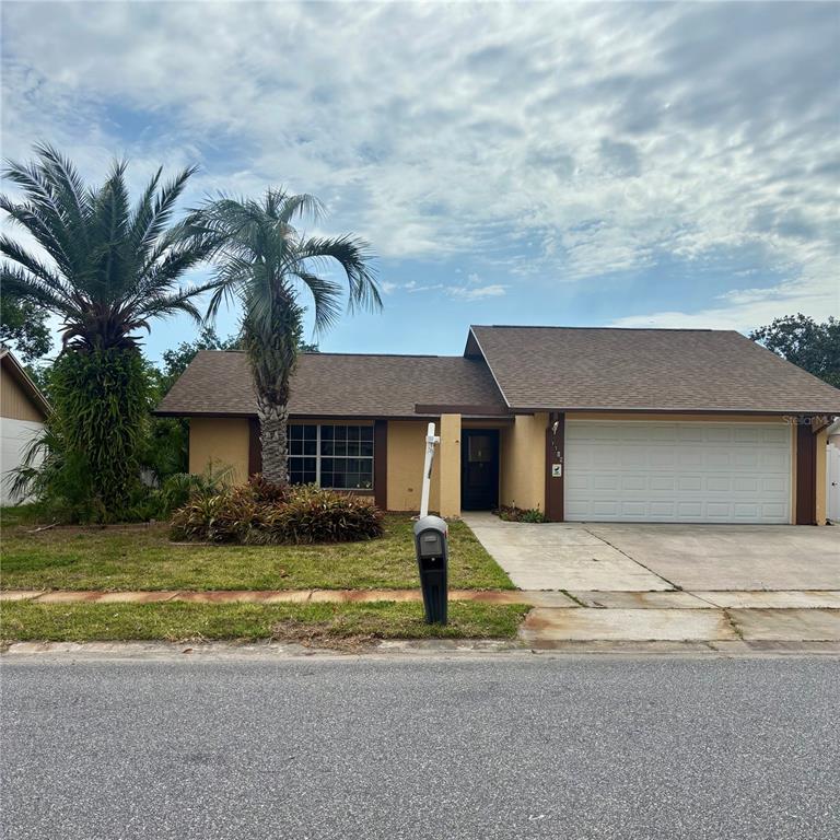 a house that has a tree in front of it