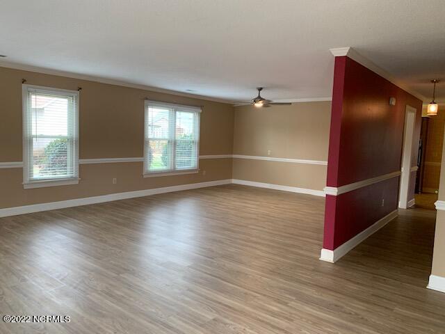 1861 Quail Ridge Road, Unit A Greenville, NC 27858 - Photo 7 of 33 Step into this open space of Living/Dining room. A wall of windows (replacements throughout by Carolina Windows) brings the outdoors in.