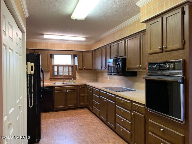 1861 Quail Ridge Road, Unit A Greenville, NC 27858 - Photo 10 of 33 Bring your decorator ideas to this kitchen with breakfast area at opposite end.