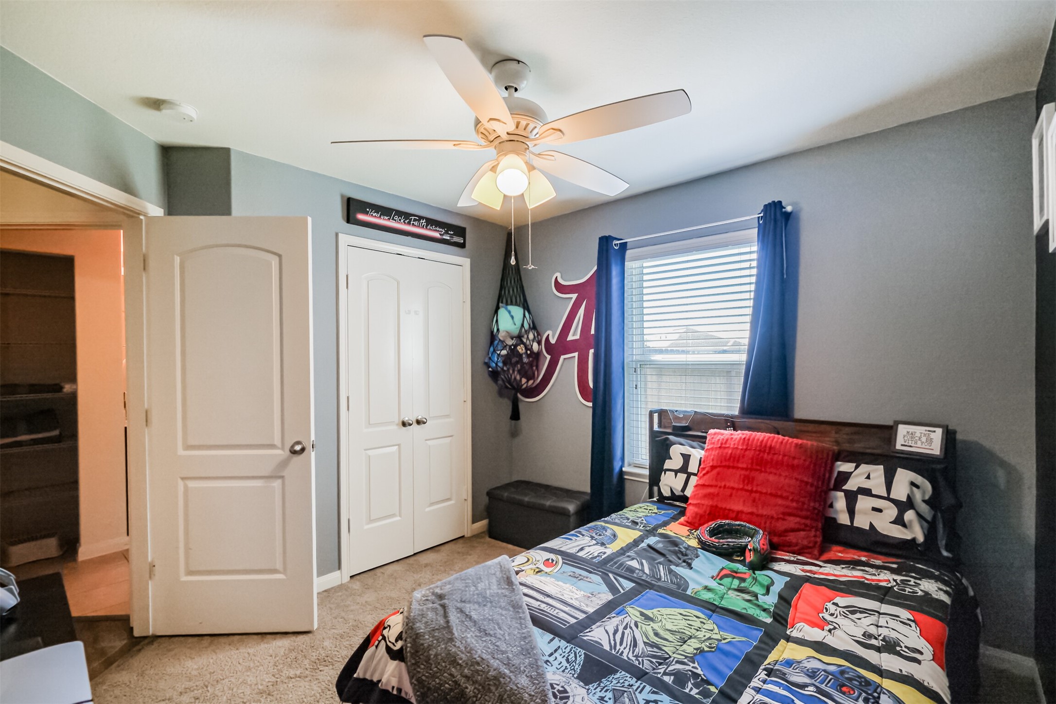 9438 Gold Mountain Drive Rosharon, TX 77583 - Photo 11 of 25 a bedroom with a bed and a chandelier