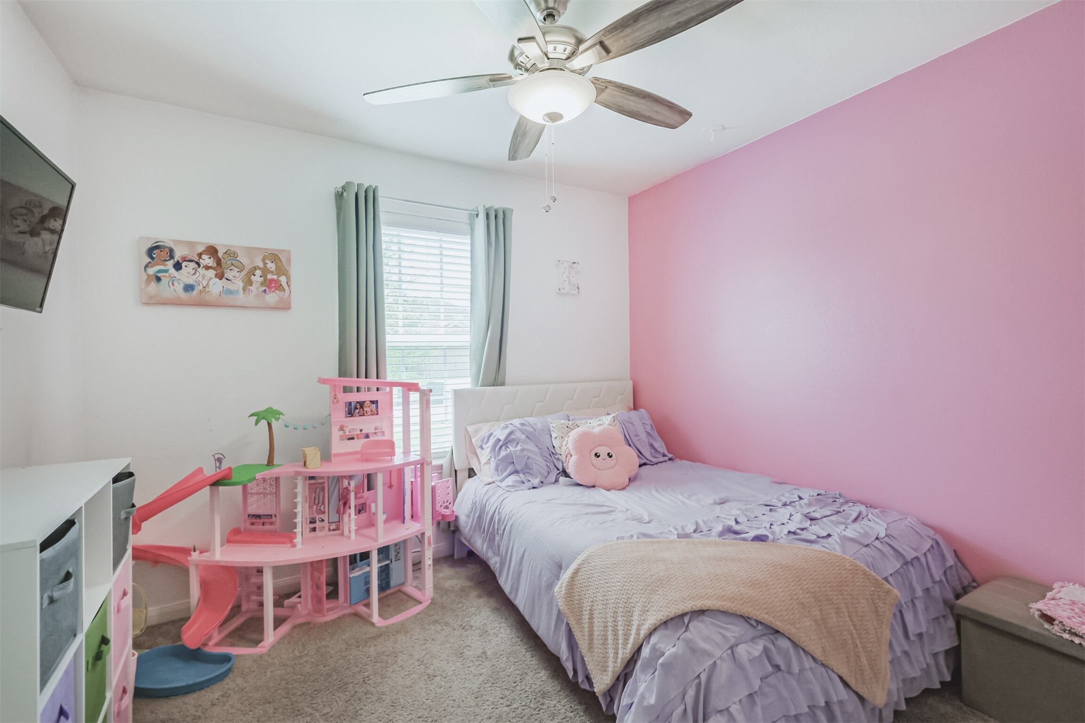 9438 Gold Mountain Drive Rosharon, TX 77583 - Photo 13 of 25 a bedroom with a bed and a chandelier