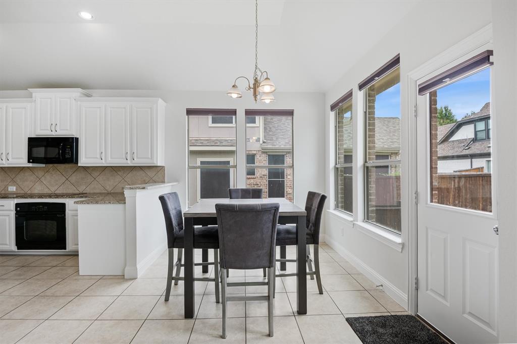 2610 Meadow Ridge Drive Prosper, TX 75078 - Photo 14 of 32 a view of a dining room with furniture window and outside view
