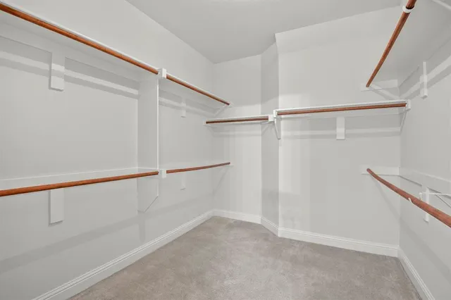 a view of an empty walk in closet