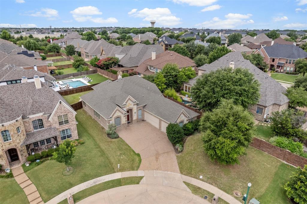2610 Meadow Ridge Drive Prosper, TX 75078 - Photo 3 of 32 an aerial view of multiple houses with yard