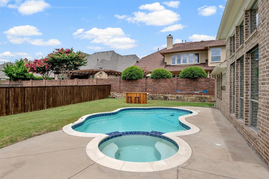 2610 Meadow Ridge Drive Prosper, TX 75078 - Photo 32 of 32 a view of swimming pool with outdoor seating and plants