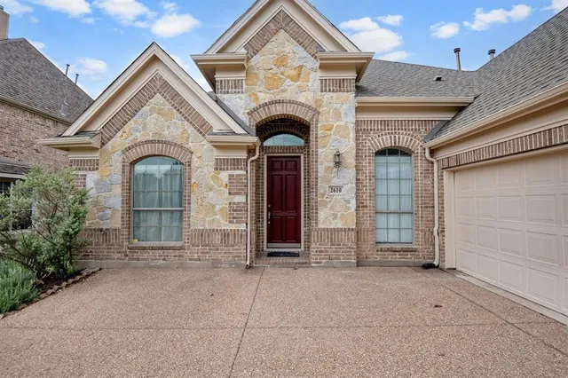 a view of a house with entrance gate