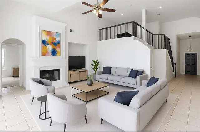 a living room with furniture and a flat screen tv