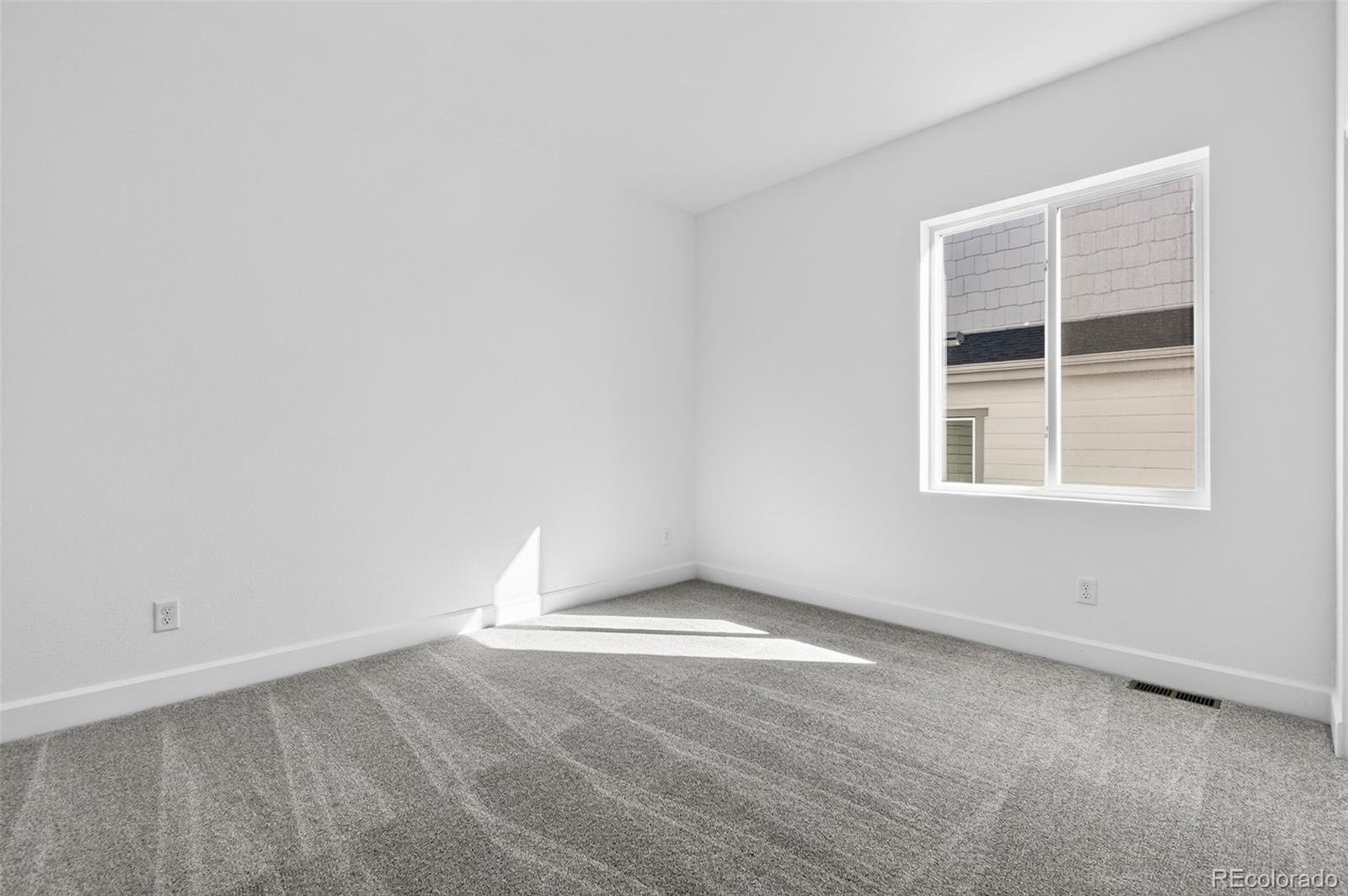 17095 West 92nd Loop Arvada, CO 80007 - Photo 20 of 37 an empty room with a window