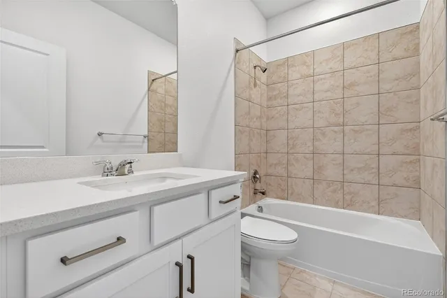 a bathroom with a sink a toilet and a bathtub