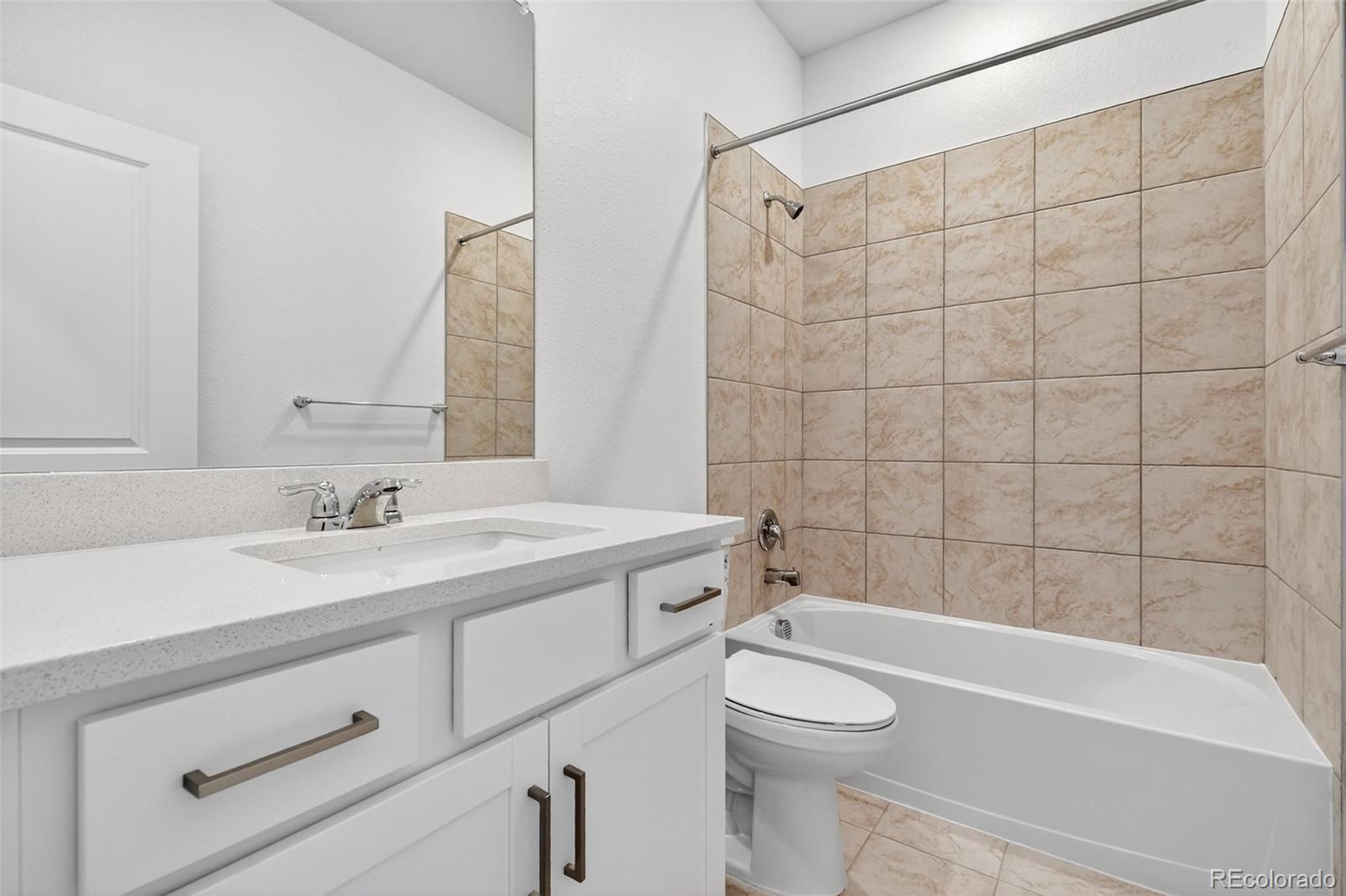 17095 West 92nd Loop Arvada, CO 80007 - Photo 21 of 37 a bathroom with a sink a toilet and a bathtub