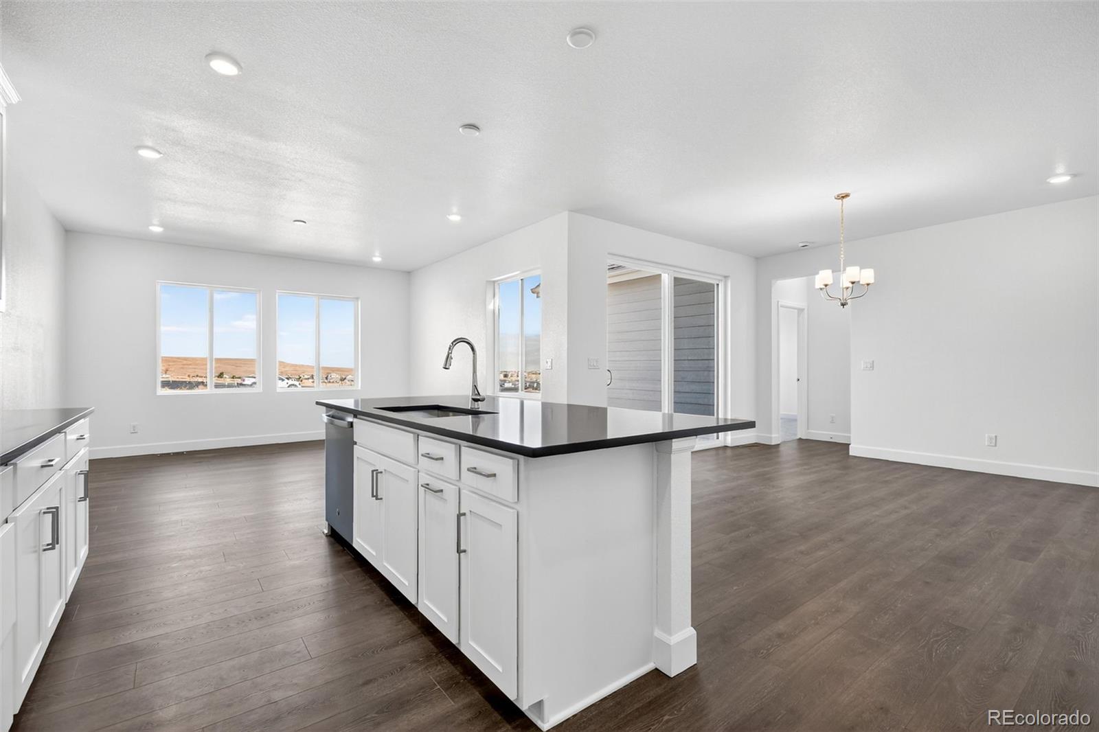17095 West 92nd Loop Arvada, CO 80007 - Photo 9 of 37 a kitchen with stainless steel appliances granite countertop a sink and cabinets