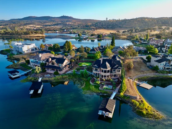 an aerial view of a house with a garden and plants