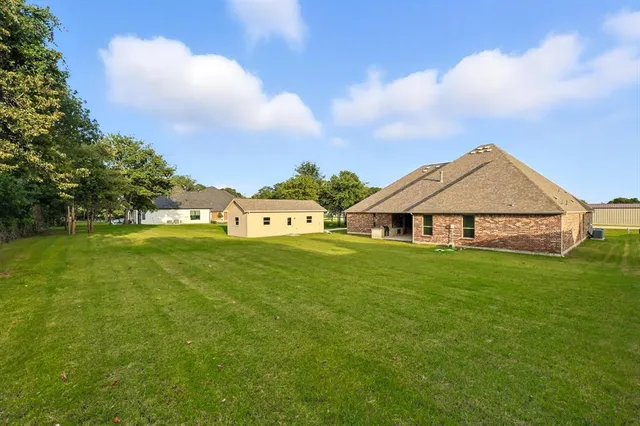 a view of a livingroom with furniture and garden