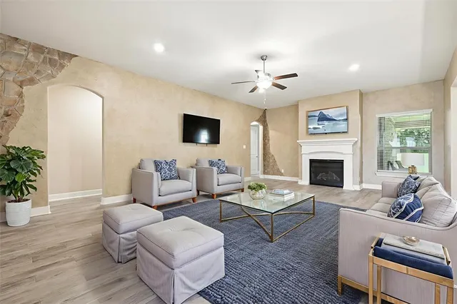 a living room with furniture and a fireplace