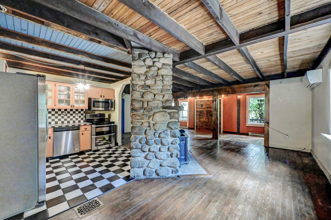 2285 Bear Town Road Canadensis, PA 18325 - Photo 21 of 58 a room with lots of wooden furniture and a rug